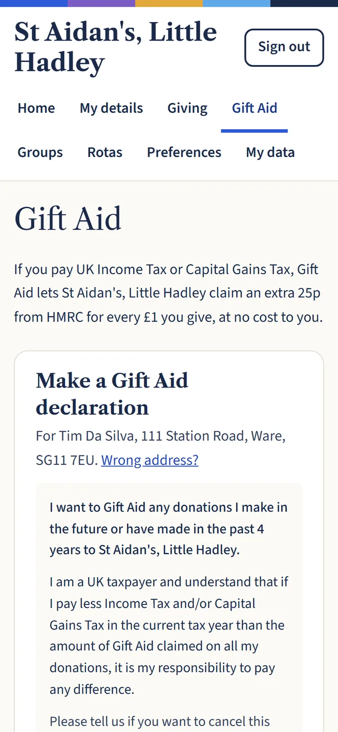 A phone showing the Gift Aid page, where a member can make a Gift Aid declaration with their name and address filled in.